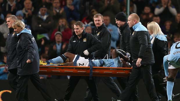 Micah Richards is stretchered off against Swansea City.